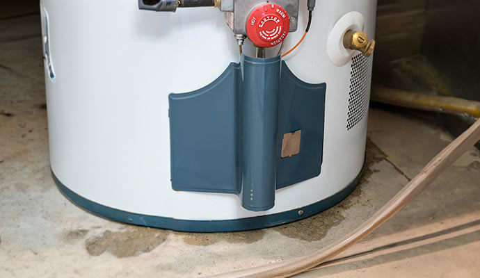A hot water heater leaking water