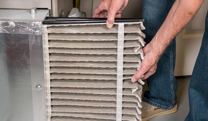 A person installing heating filter