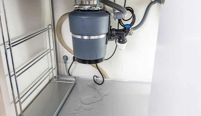 A garbage disposal unit installed by Cousino Restoration & Environmental
