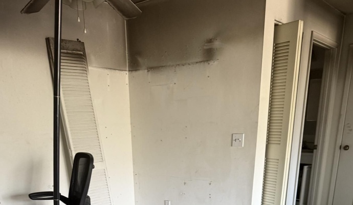 Bedroom fire damage before restoration cousino