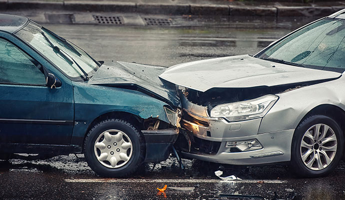 A head-on collision between two sedan car