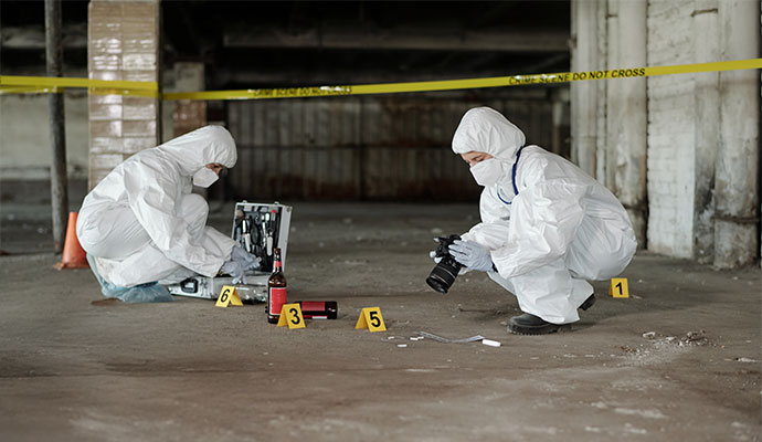 Professional team cleaning trauma site