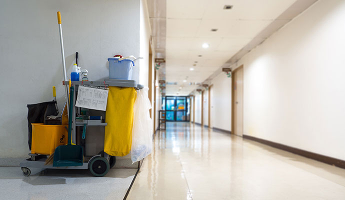Cleaned commercial property hallway with a cleaning cart
