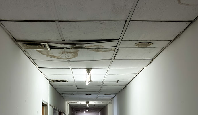 Water leak damaged commercial property ceiling