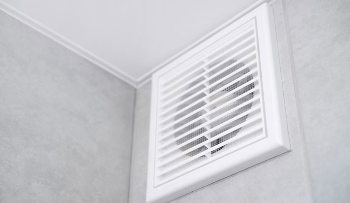 Air vent on a bathroom ceiling.