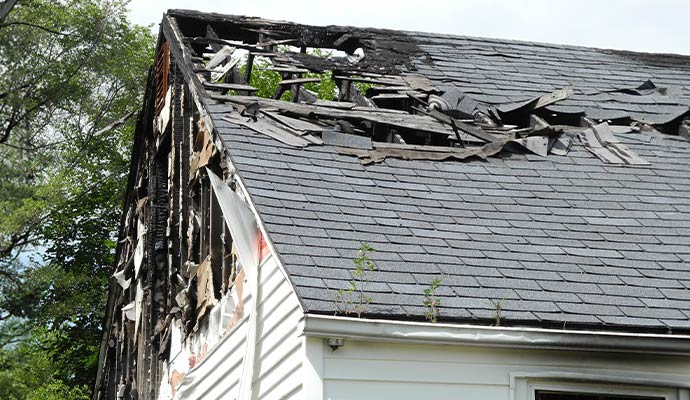 Fire damaged residential house roof