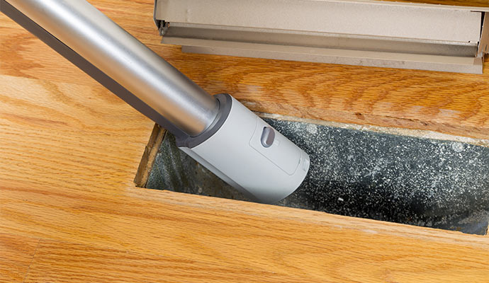 HVAC air vent cleaning by Cousino Restoration & Environmental professional