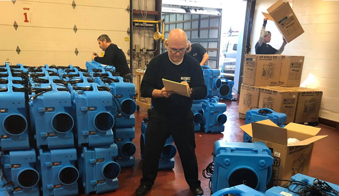 Cousino Restoration & Environmental worker are organizing commercial restoration equipment