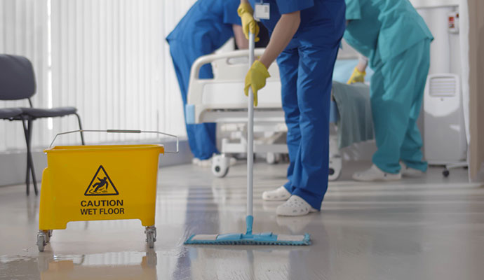 A professional cleaning hospital floor with equipment