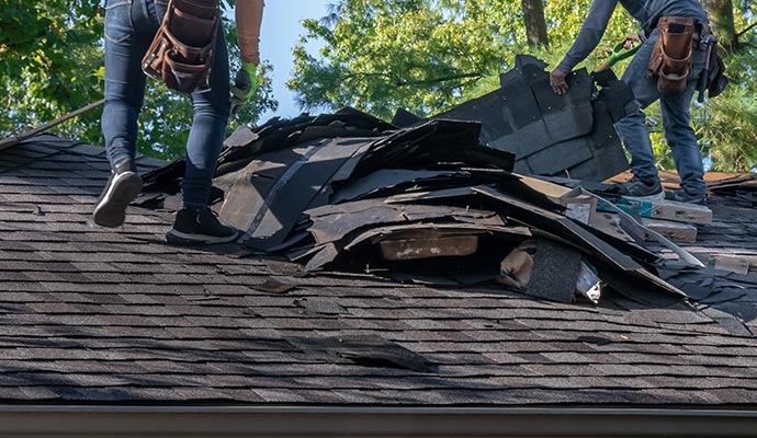 Residential house roof reconstruction service by Cousino Restoration & Environmental team