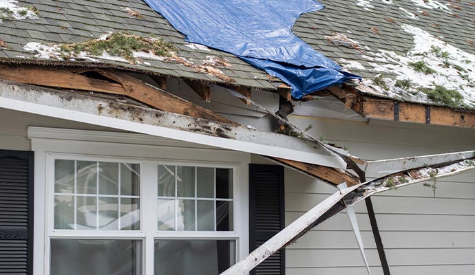 Gutter and siding storm damage house
