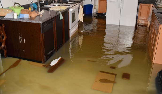 Severe storm flooding and standing water on kitchen floor