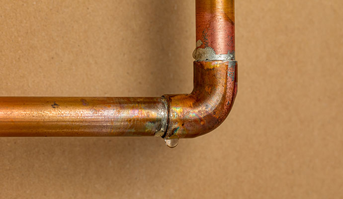 Water leaking from a copper joint pipe