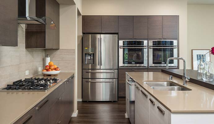 Modern kitchen with stainless steel refrigerator
